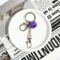 Porte-clés coloré accessoire DIY avec cloche violette et fermoirs métalliques pour sacs. - Fermoir Doré Chaîne à Quatre Sections (Cloche Violette)