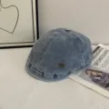 Retro denim flat cap detail, vintage wash ivy beret with metal logo tag on white table. - M (56-58cm) / Light Blue