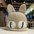 Cute handmade crochet cat ear knit hat for women, warm winter beanie with big eyes design. - M (56-58cm) / Off White