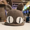 Cute brown knitted beanie hat with cat ears and big eyes for women winter warm stylish headwear - M (56-58cm) / Coffee