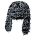 Detailed view of black and white shaggy knit ushanka hat with long ear flaps streetwear style. - M (56-58cm) / Black and White