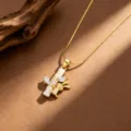 Detailed close-up of gold-plated rabbit and bamboo pendant necklace with sparkling cubic zirconia. - Rabbit Hugging Bamboo Style (T0986) / Gold