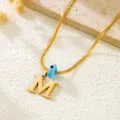 Gold snake chain necklace featuring initial letter M pendant and blue evil eye charm for women. - Letter M / Gold