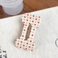 Cute bone-shaped polka dot hair clip for women, stylish acrylic duckbill clip accessory. - Pink White Polka Dot