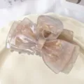 Elegant acetate hair claw clip featuring bow shape and marble pattern for stylish daily use. - Dusty Pink