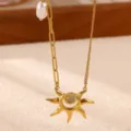 Gold sun pendant necklace with mixed chain and pearl detailing. Elegant fashion jewelry piece. - Sun Pendant Necklace