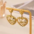 Gold-plated stainless steel heart Mama earrings detail view, sparkling cubic zirconia design. - Earrings