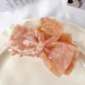 Elegant pink marble bow hair claw clip, stylish acetate shark clip for women daily hair styling. - Light Orange