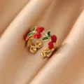 Close-up detail of cute cherry open ring with red enamel and green leaves on silk. - Red Fruit Green Leaf Design (JZ9696G)