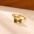 Gold stainless steel double bow ring featuring vibrant colorful cubic zirconia and open design. - Double Bow Style (JZ10411G) / Gold