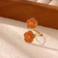 Gold stainless steel open ring with double orange flower motifs and beaded edge design. - Double Orange Flower Beaded Edge Style (JZ10404G) / Gold