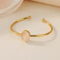 Stainless steel gold cuff bracelet featuring a delicate teardrop pink stone detail. - Waterdrop Pink Faux Jade Style (B2040G-2)