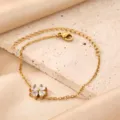 Gold plated stainless steel four leaf clover zircon bracelet close up jewelry detail view - White