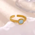 Close-up detail shot of the gold-plated stainless steel open ring featuring a blue resin inlay. - Azure Round (JZ9505)