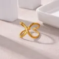 Close-up of gold plated stainless steel open ring with modern geometric cross design for women. - Cross Wrap 3D Style(JZ9566G)