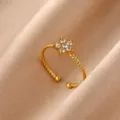Close-up detail of the 18K gold plated stainless steel cubic zirconia flower open ring. - Open Ring / White