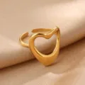 Gold open hollow heart ring detail shot, minimalist geometric metal finger jewelry close-up. - Gold Hollow Heart Style (JZ9748G)