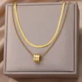 Elegant double layer gold necklace featuring sleek snake chain and chic pendant for women daily wear. - Double Layer Snake Chain Triple Ring Cylinder Style (N04725G) / Gold