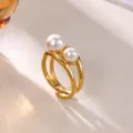 Detail view of minimalist 18K gold plated open ring with double white pearls on textured surface. - Double Pearl (JZ9456G)