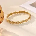 Gold stainless steel floral rhinestone bracelet open cuff fashion jewelry for women daily wear - Multiple Small Flowers Connected Style (B2486G)