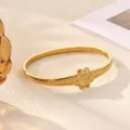 Gold stainless steel flower bangle bracelet with sparkling center rhinestone for women. - Central Three-Dimensional Flower Style (B2481G)