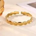 Fashion gold open cuff bracelet with elegant twist leaf texture, stylish metal wristband accessory. - Twisted Wave Texture Style (B2435G)