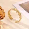 Gold stainless steel star cuff bracelet, trendy organic textured open bracelet for women. - 3D Star Relief Carved Style (B2433G)