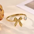 Gold plated stainless steel sparkling crystal bow open cuff bracelet for daily wear fashion - Metal Wavy Bowknot Style (B2283G)