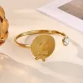 Gold-plated open cuff bracelet with straw hat charm and crystal detail, chic wrist jewelry. - Unique Straw Hat Bowknot Style (B2282G)