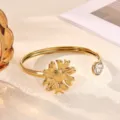 Stainless steel open bangle bracelet featuring a sunflower charm and sparkling crystal rhinestone. - 3D Sunflower Style (B2273G)
