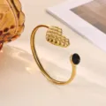 Gold open cuff bracelet featuring a stylish quilted heart and black crystal detail. - Black Rhinestone Quilted Heart Style (B2271G-2)