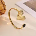 Gold color stainless steel open cuff bracelet with textured heart and black crystal stone. - Black Rhinestone Hammered Heart Style (B2279G-2)