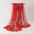 Detail view of a vibrant red floral chiffon scarf, elegant long beach shawl and wrap accessory. - Chiffon Scarves 3