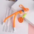 Cordon tressé orange pour téléphone et clés avec un joli pendentif visage souriant. - Cordon visage souriant orange