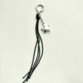 Porte-clés tressé minimaliste en cuir avec pendentif étoile argentée pour sacs - Noir