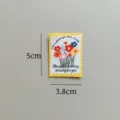 Close-up of cute floral stamp woven fabric patch for DIY handmade sewing clothing accessories. - Sunflower