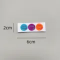 Detailed closeup of colorful embroidered smiley face fabric label for DIY clothing decoration. - zm0010