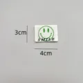 Detailed view of green smile embroidered patch, clothing DIY accessory, approx 3x4cm size. - zm008
