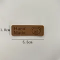 Brown PU leather handmade label tag with cute bear pattern, 5.5x1.8cm for DIY crafts hat bag. - Dark Coffee Bear / L