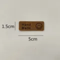 Handmade leather label with smiley face, DIY clothing accessory sized 5x1.5cm for crafts. - Smiley Face Dark Brown / M