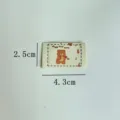 Detail shot of handmade cartoon bear woven clothing label, DIY sewing accessory fabric patch. - Bear Style (sy0304)