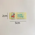 Handgemaakt geweven stoffen label met schattig fruitpatroon en strepen voor kleding. - Sinaasappeltas