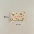 Cotton fabric label for handmade DIY clothing, cute cartoon cloud design with red dots. - Cloud