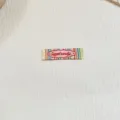 Woven clothing label patch with colorful stripes and cute embroidery design for DIY handmade crafts. - ZM847