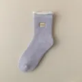 Plush lined thick winter crew sock detail view with sweet embroidery patch and fuzzy trim. - One Size / Lavender