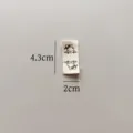 Pure cotton handmade folded side label with cute cow pattern, sized 4.3x2cm for garments. - Cow Cloth Label (sy158)