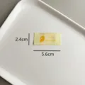 Étiquette tissée jaune pour vêtement avec motif de pastèque et texte mignon 2.4x5.6cm - zm028