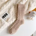 Close-up of cozy cable-knit fuzzy winter socks in soft warm texture, perfect for cold indoor days. - Non-Shedding / Coffee