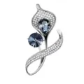Detailed view of silver floral brooch with clear pavé crystals and sparkling blue stones. - A-2-16 (Deep Blue)