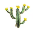 Close-up detail of cute cactus brooch, green enamel and yellow flower, shiny gold-tone metal. - Green